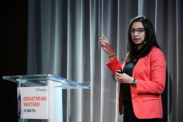 A woman speaks at a lectern